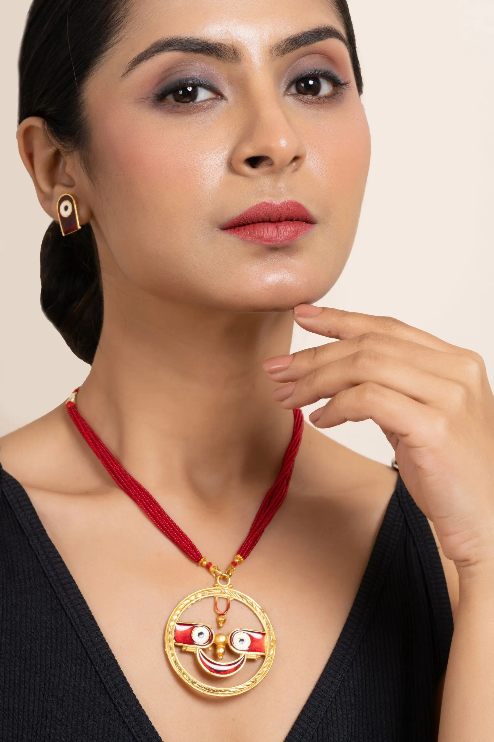 Gold Plated Meenakari Round Jagannath Pendant Necklace with Matching Earrings & Red Tussle Jewelry Set