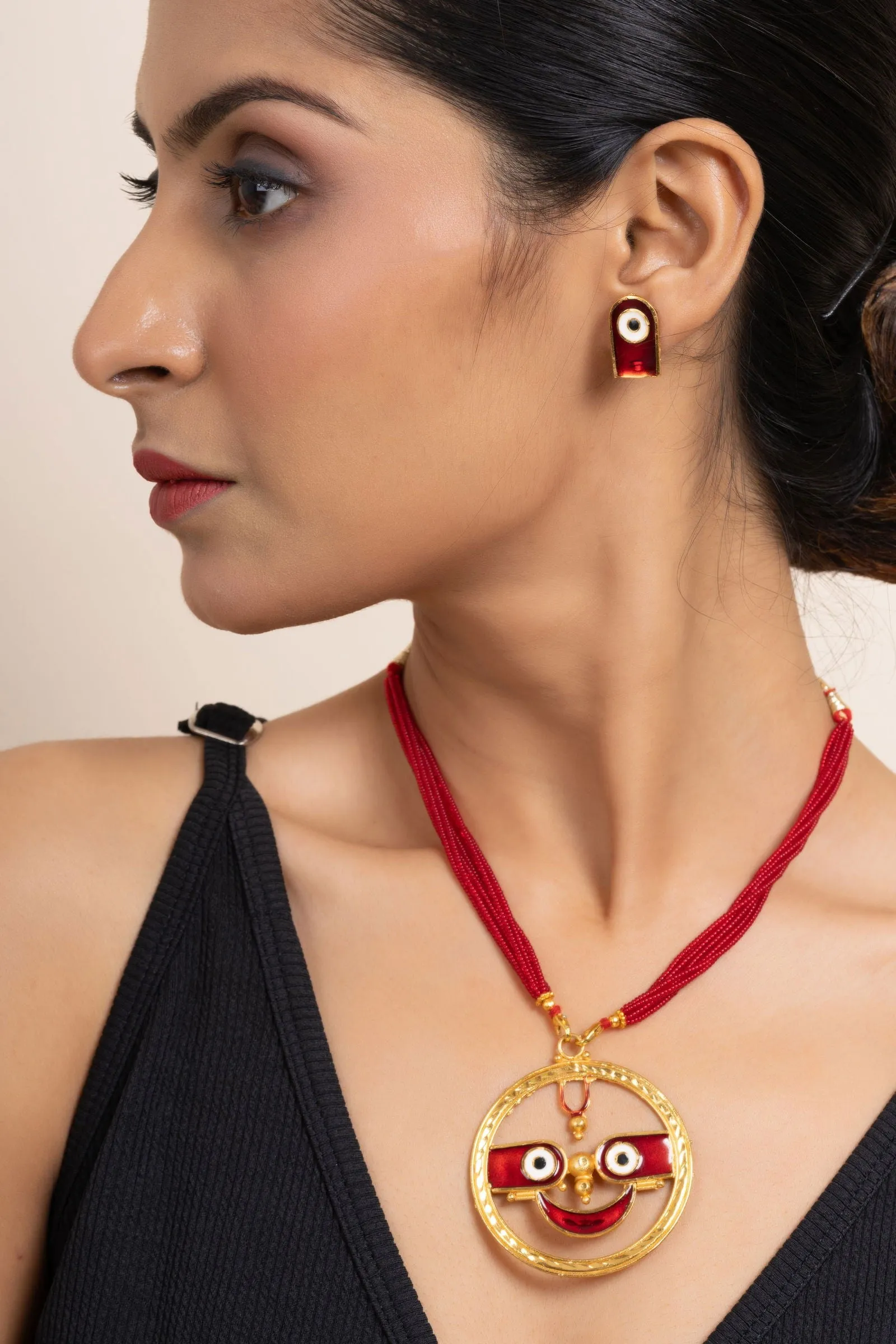 Gold Plated Meenakari Round Jagannath Pendant Necklace with Matching Earrings & Red Tussle Jewelry Set