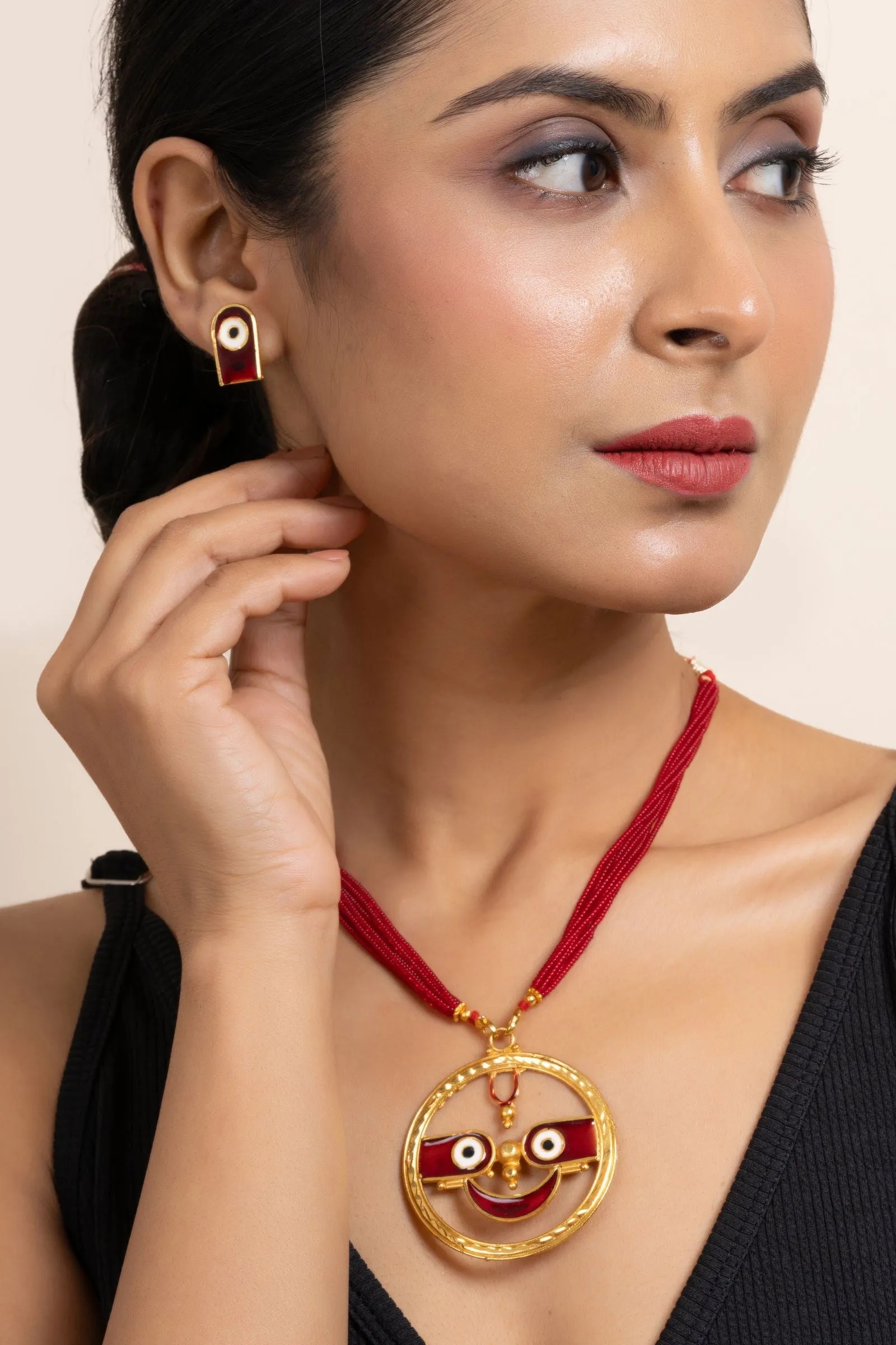 Gold Plated Meenakari Round Jagannath Pendant Necklace with Matching Earrings & Red Tussle Jewelry Set